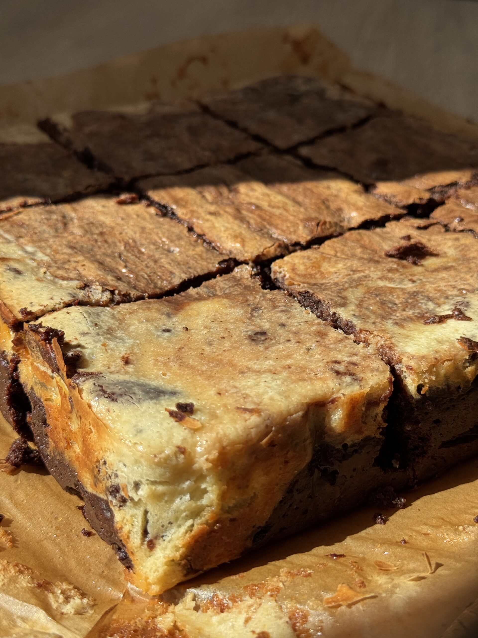 Square slices of the cheesecake chocolate brownie